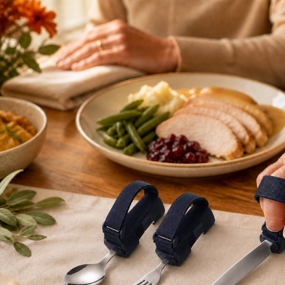 Deep navy adaptive spoon, fork and knife set at a warm family meal