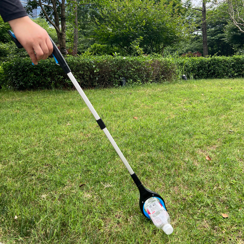 Reacher picking up a plastic bottle from grass