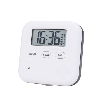 White and gray reminder pill box with clock display